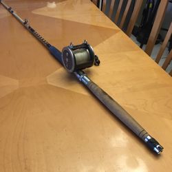 Penn Senator Special Reel 4/10 W/ 6’ 5” Hurricane fishing rod, specifically the 11-7 6/0 DX model, made by Spinmaster Rod Company in Miami, Florida. I