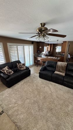 Dark brown reclining sofa and love seat