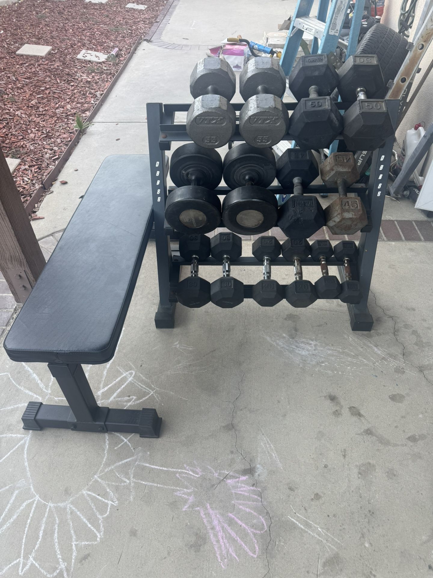 Dumbbells weights 10-60 plus rack 540lbs total and flat bench