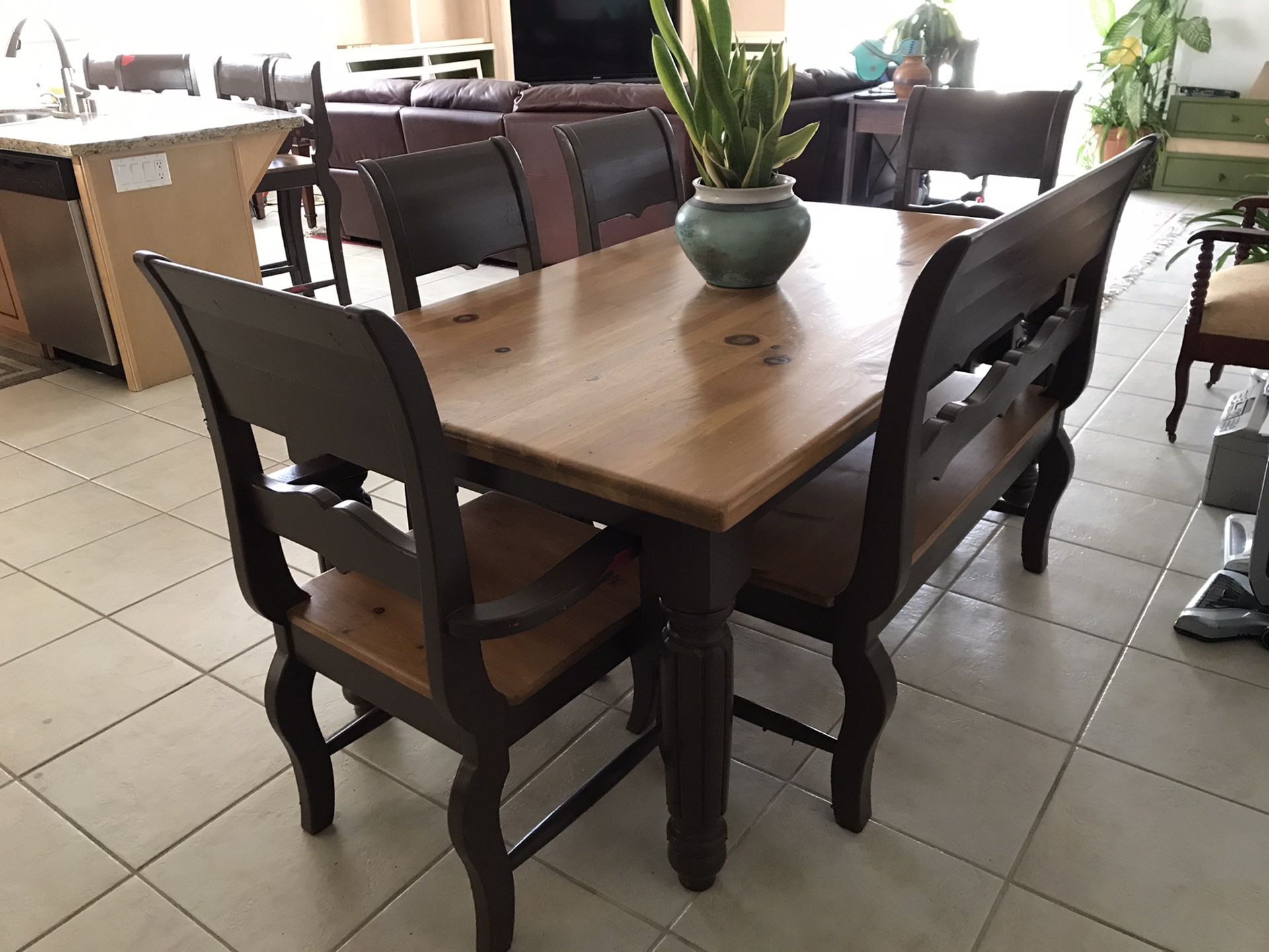 Dining room table. 100% wood includes 4 chairs and a bench. Excellent condition