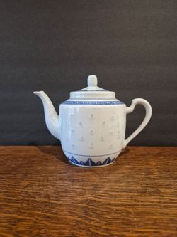 Traditional Chinese Blue-and-White Porcelain Teapot, featuring a translucent "rice grain" or "rice eye" pattern.