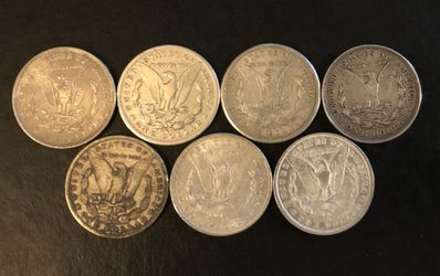 7 Morgan Silver Dollars