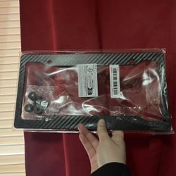 Not real Carbon fiber   ONE  license plate frame matte finish  Plastic !  New !!   Pick up in seaside
