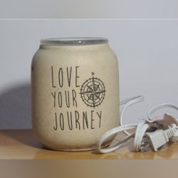 Scentsy Love your Journey wax warmer
has a little wax on it