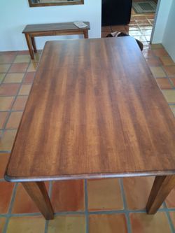 36x60 table with four chairs and a bench