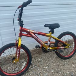 Genesis One Eight 18" BMX Boy's Bike in red.