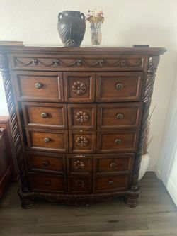Traditional ornate dark wood chest of drawers