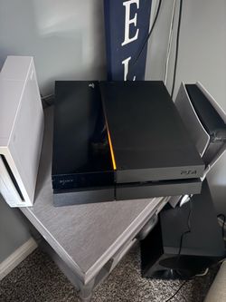 playstation 4 with 9 games and 2 controllers