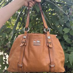 Madison Mia leather tote bag in a brown color. 