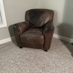 2 leather lounge chairs and 1 ottoman 
