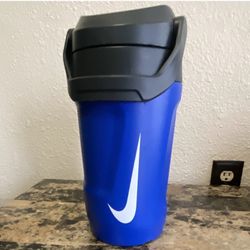 Nike 64 oz Blue Plastic Reusable Water Bottle, screw-on lid handle.