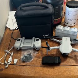 Potensic Atom no Charger have Everything But Charger No  in Amazon The drone cost $350 The Wings Are Ok If You Whant I can change