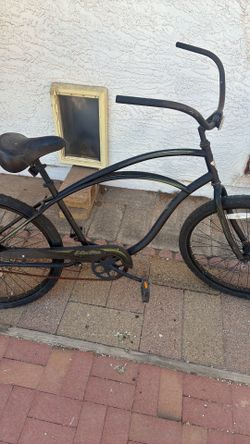 Electra bicycle co. black w/ green pin stripe.