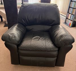 2 identical black leather reclining gliders. $299 if you buy one but if you buy both $549
