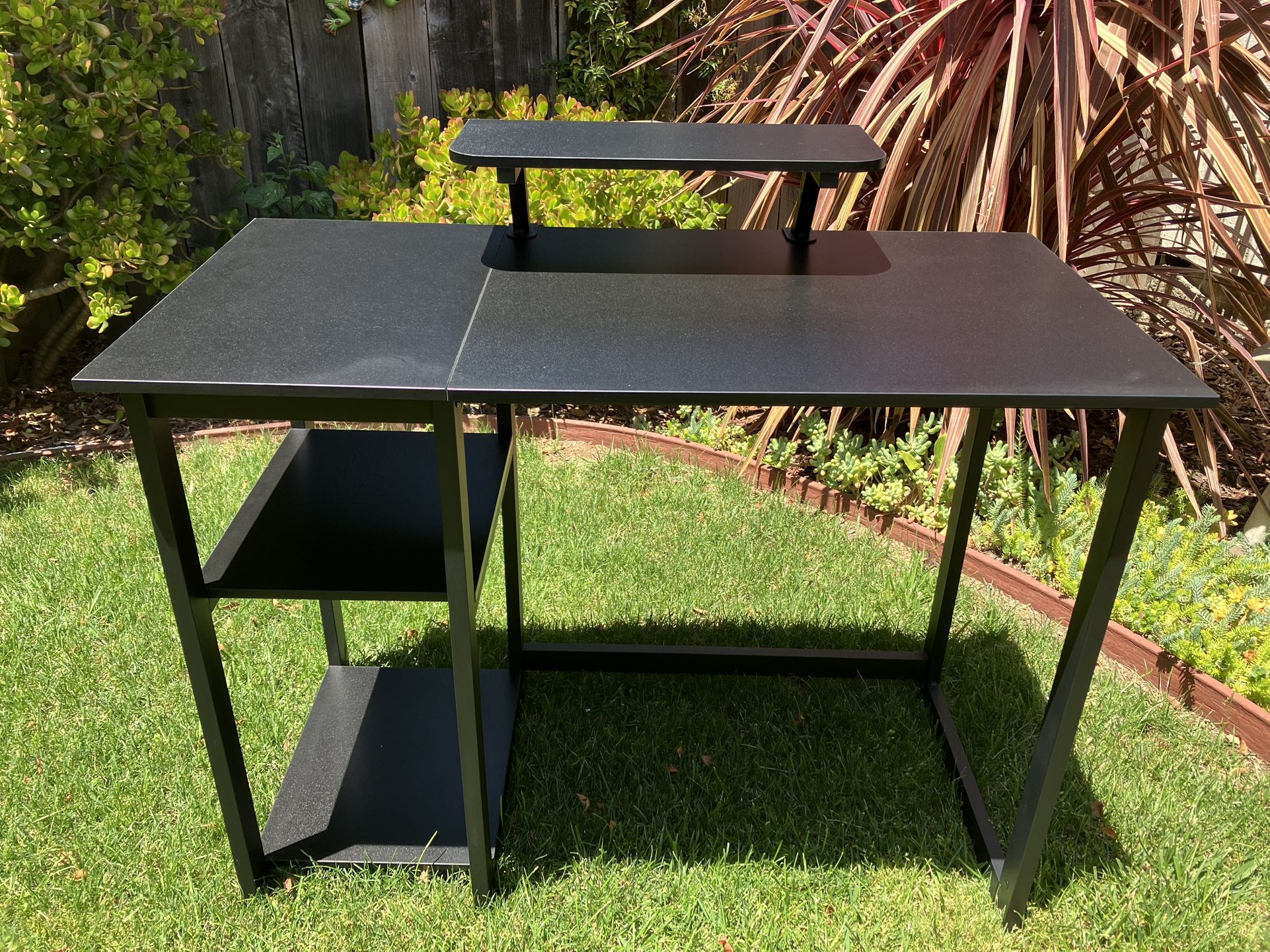 Like new///Black desk with built-in monitor riser & shelves