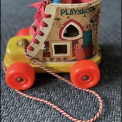 Playskool "Old Woman in the Shoe" wooden pull toy.