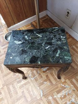 Vintage ed table with dark green marble