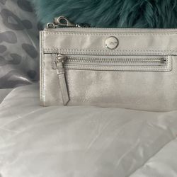 Coach, silver shiny wristlet