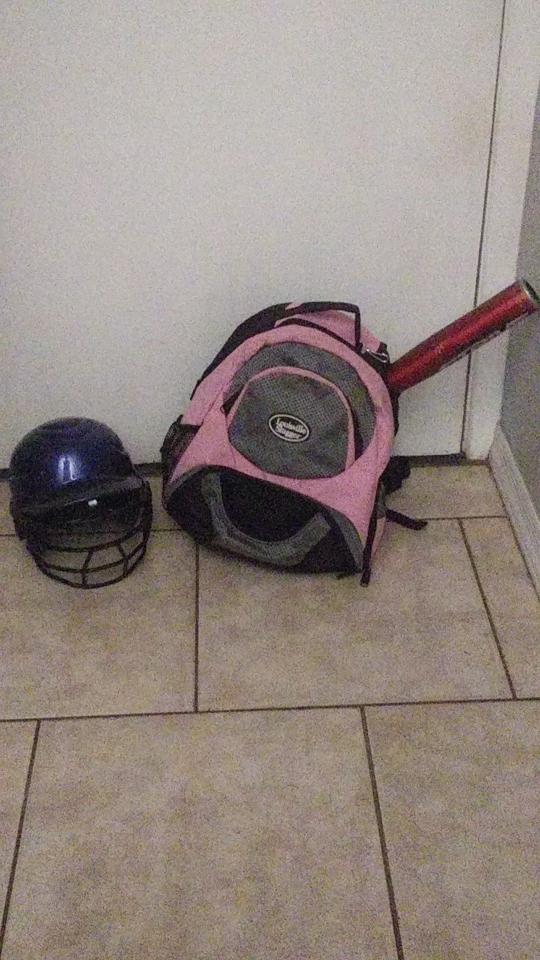 Backpack for baseball gear batting helmet and a bat the bat does havep a dent in it. The helmet is s one size fits all but tagged as a 6-1/2 -7-1/2