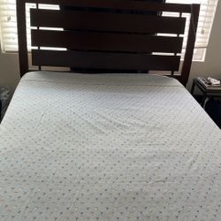 Dark brown full size bed frame. Comes with spring box (no mattress)