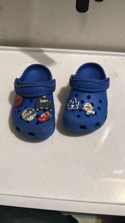 Blue crocs tons of charms size 8c