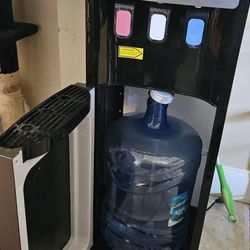 Bottom Loading Water Dispenser with 6 gallon bottles storage