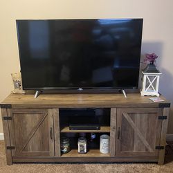 tv stand and 50" tcl roku tv