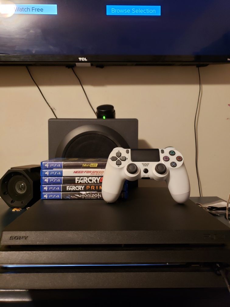 Ps4 pro with wired remote and games (PENDING PICKUP)