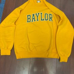 Yellow sweater with green baylor college writing on it