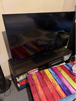 Flat-screen TV (not a smart tv) with remote