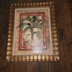A Wall Picture With Golden Wood Frame