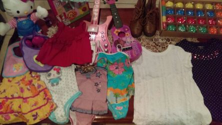 Toys baby clothes and kids clothes an baby guitars