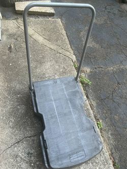Rubber made trolley handle folds down