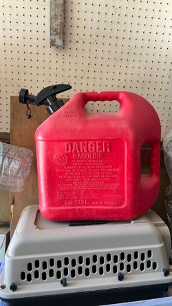 A used 5-gallon plastic Blitz gas container