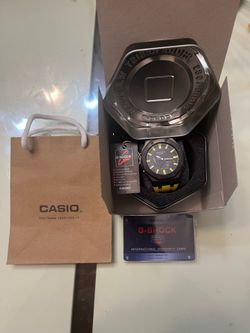 Black and yellow g shock watch