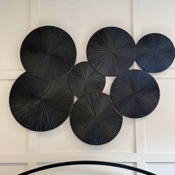 Wood Plate Carved Pinwheel Wall Decor  This item measures 53L x 1W x 38.50H inches, and weighs 32 lbs