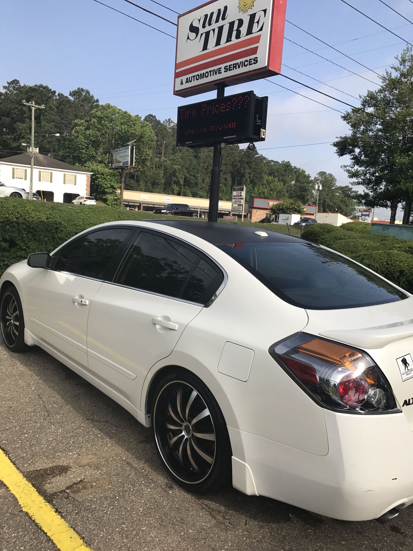 Trade 20 inch rims and tires. For 18 inch Nissan Altima or maxima rims and tires