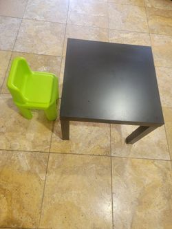 Kids table and on green chair
