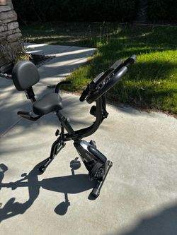 Foldable exercise stationary bike with built in resistance bands