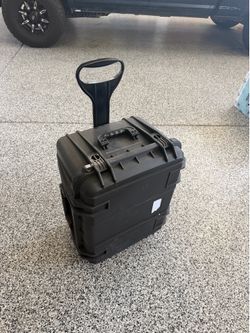 Hard sided wheeled case.