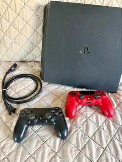 Adult owned Sony PS4 with controllers