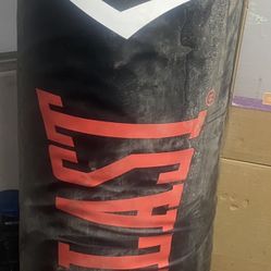 Bench And Punching Bag With Gloves