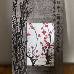 Decorative Asian-style photo frame featuring a textured metallic finish and a printed red cherry blossom design