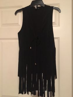 Brand new women’s size small black suede fringe vest. Ties in front. Smoke free home.