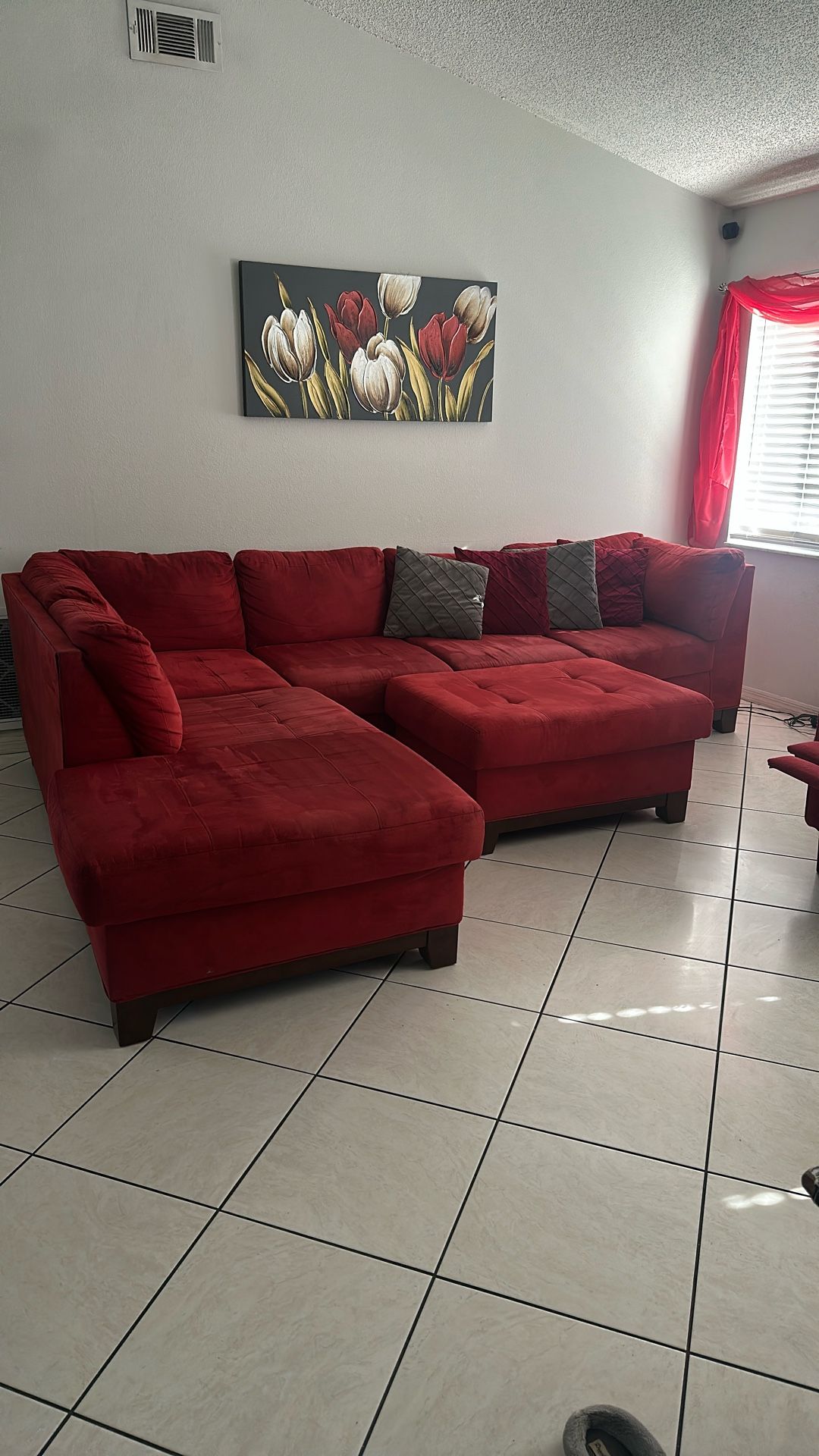 Living Room Sectional With ottoman And Decorative Pillows, Separate Recliner Chair, Wall Art And Curtains