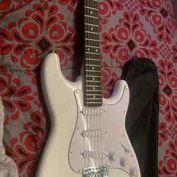 Electric Guitar And Comes With A pick And A Wammy Bar Tuner 