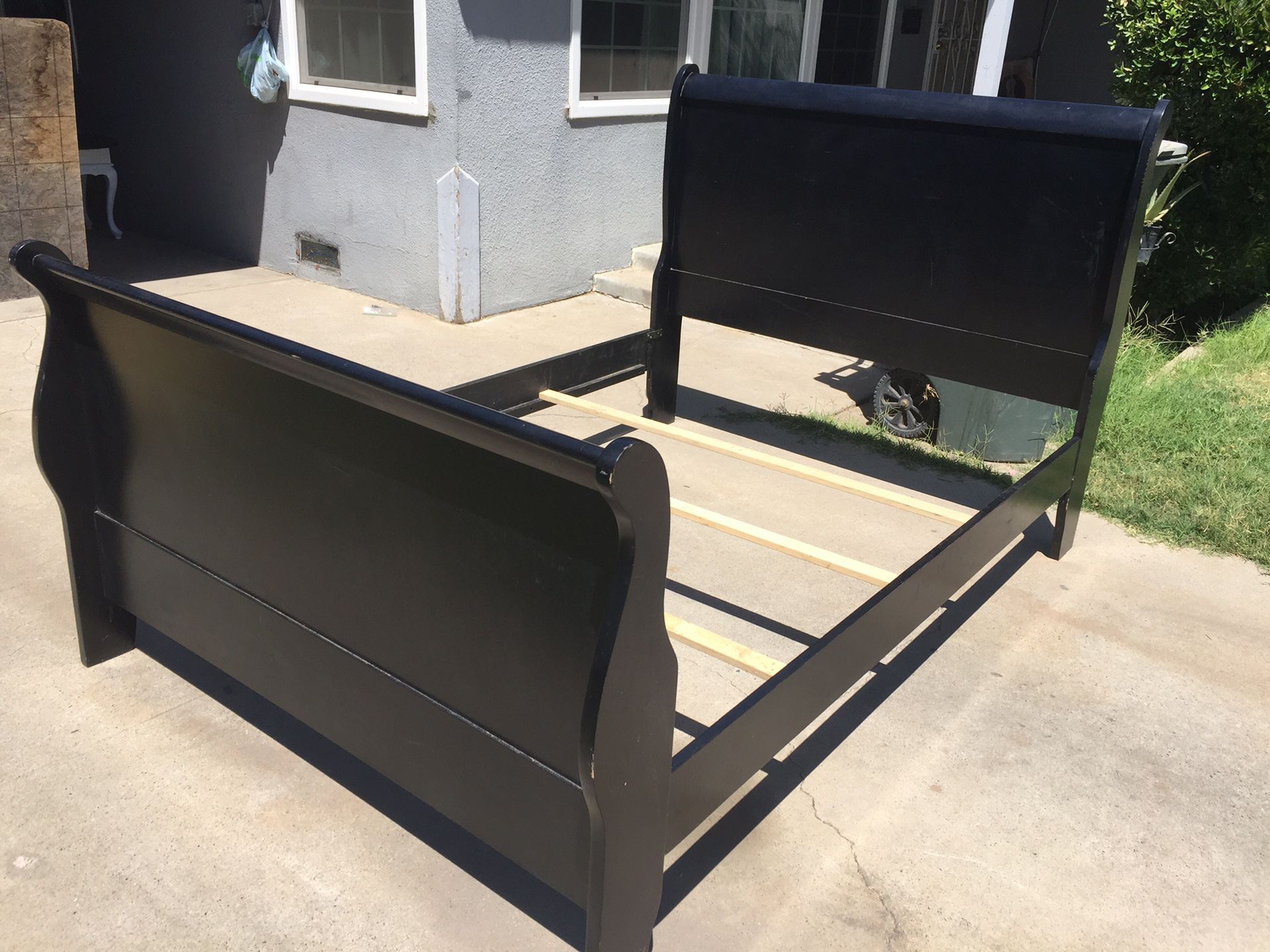 Black full bed frame in good condition.