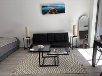 Square glass coffee table with rug included