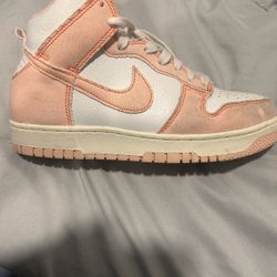 Pink and white Nike dunk highs 