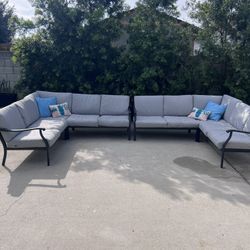 Two Outdoor Sectionals With Covers And Decorative Pillows